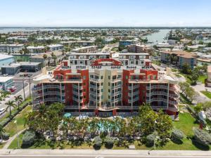 an aerial view of a building in a city at August Beach Getaway Specials Book & Save! in St. Pete Beach