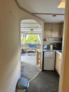 an interior view of a kitchen in an rv at 48 River View in Dunoon +11 photos