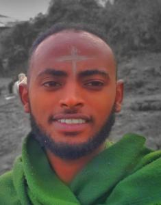 a man with a cross painted on his face at Abel haile in Moyalē