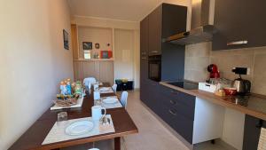 a kitchen with a dining table and a counter top at B&B Capo Vaticano Stay in Capo Vaticano