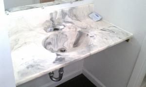 a white marble sink in a bathroom at Valley Motel Pittsburgh in Harmarville +37 photos