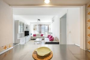 a living room with a couch and a table at Valdelagrana en Primera Linea in El Puerto de Santa María