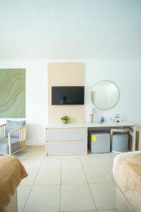 a bedroom with a desk and a mirror at Playa Blanca Beach Resort - All Inclusive in Playa Blanca
