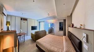 a bedroom with a bed and a desk in a room at Tornola Luxury Rooms in Termoli