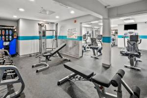 a gym with several treadmills and cardio machines at Bay Watch Resort 1735 - Direct Oceanfront Balcony with Pools and Lazy River in Myrtle Beach
