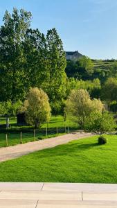 a dirt road in a field with trees and grass at Studio Cosy in Coussergues