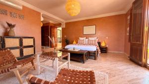 a bedroom with a bed and a table at Villa Amazonika By La Siredrah in Segraga