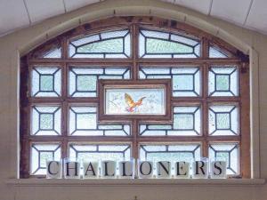 a window in a building with a bird on it at The Challoners in Robertsbridge