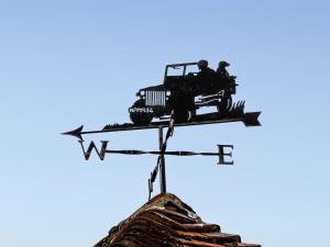 a weather vane on top of a roof at The Challoners in Robertsbridge