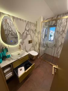 a bathroom with a sink and a toilet and a shower at Hotel BOUTIQUE in Tisno +66 photos