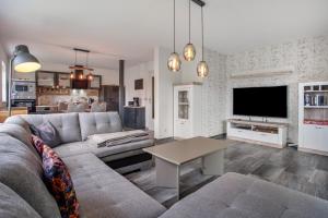 a living room with a couch and a table at Ferienwohnung 3 in Gribow