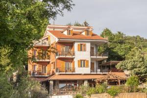 a large building with an orange roof at Allegria in Baiardo