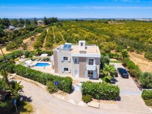 an aerial view of a villa with a car at Roots Villa - Casa das Árvores in Cabanas de Tavira