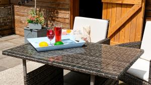 a table with two glasses and a box on it at Afan Forest Retreat Bikes, Pets, Family,Workers in Cymmer +53 photos