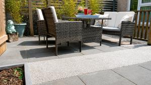 a patio with a table and chairs on a patio at Afan Forest Retreat Bikes, Pets, Family,Workers in Cymmer