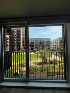 a window with a view of a field outside at sPARSH in London