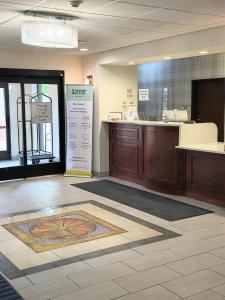 a lobby of a store with a counter at Grander Inn & Suites by IHG in Tyler