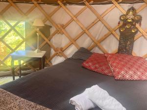 a bedroom with a bed in a yurt at Adorable Yurt Glamping Bantry in Bantry