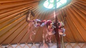 a cross in a tent with flowers on it at Adorable Yurt Glamping Bantry in Bantry