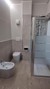 a bathroom with a shower and a toilet and a sink at Damhomeitaly in Modena +38 photos