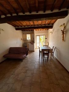 a kitchen and dining room with a table and chairs at La Sosta Nel Chianti in Castelnuovo Berardenga +4 photos
