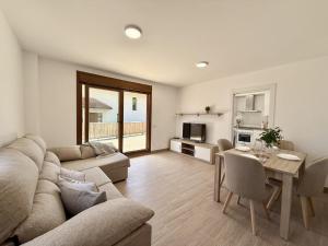 a living room with a couch and a table at La Villa de Miera - 12809 in Ajo