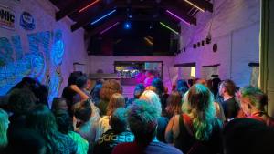 a crowd of people sitting in a room at a party at Harley's in Aberystwyth +5 photos