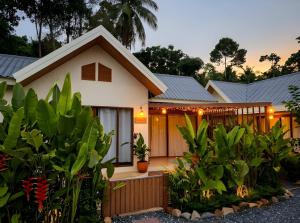 a house with a lot of plants in front of it at Thara Coco Villa - Boutique Luxury In Srithanu in Hinkong