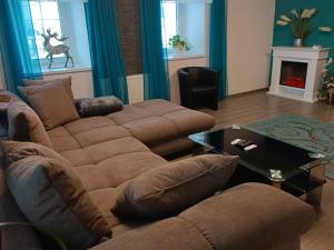 a living room with a couch and a table at Ferienhaus Strohmayer in Schweiggers