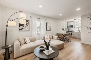 a living room with a couch and a table at The Luxury Haus in Grove City