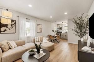 a living room with a couch and a table at The Luxury Haus in Grove City +26 photos