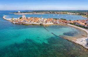 an aerial view of a small island in the water at 4SONS UMAG Sea View 2BR Apartment in Town center !NEW! in Umag