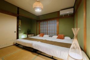 a bedroom with a bed with a hammock in it at Castle Land NAGOYA Family Friendly 5min from Station in Nagoya