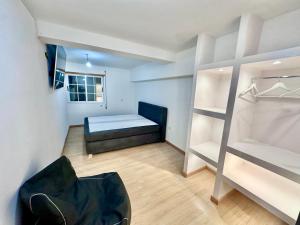 a bedroom with a bed and a bunk room at Estúdio com cozinha e casa de banho! in Bragança