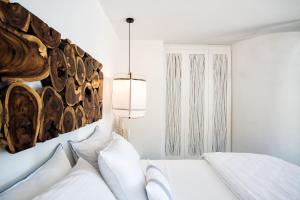 Cama ou camas em um quarto em Blue Sand Boutique Hotel & Suites