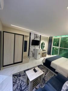 a hotel room with a bed and a couch at شقق فاخرة in Riyadh