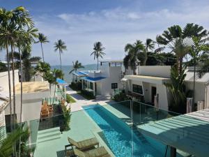 an aerial view of a house with a swimming pool at Casa By The Sea in Bangrak Beach