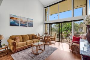 a living room with a couch and a table at Makani A Kai B11 in Wailuku