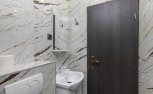 a bathroom with a sink and a toilet and a mirror at Miljak in Duće +38 photos