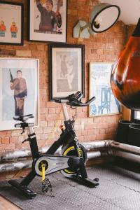 a bike is parked against a wall with pictures at Jason Works in Loughborough