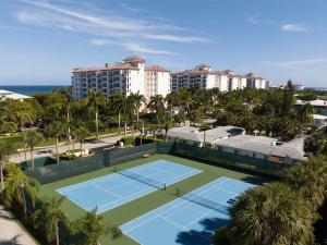 an aerial view of a tennis court in front of a building at Ocean Pointe Resort One-Bedroom Villa in Palm Beach Shores