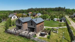 an aerial view of a house in a field at Monialuki in Nogat