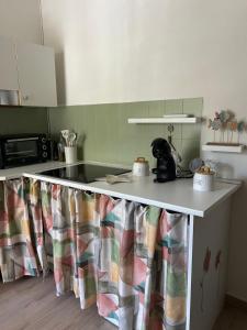 a kitchen with a counter top in a kitchen at MareMare Follonica in Follonica