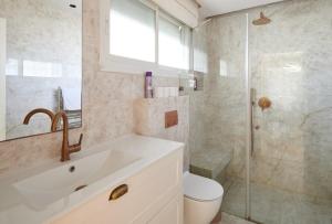 a bathroom with a sink and a toilet and a shower at GABRIEL APARTMENTS - Jacuzzi & Panoramic JLM View Steps to Shaare Zedek Hospital in Bayit Wegan +19 photos