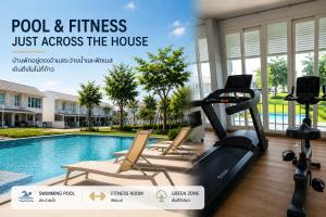 a fitness room with a pool and fitness equipment at 18TU Thammasat in Pathum Thani