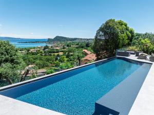 an infinity pool in a villa with a view at Casa Veronica in Manerba del Garda