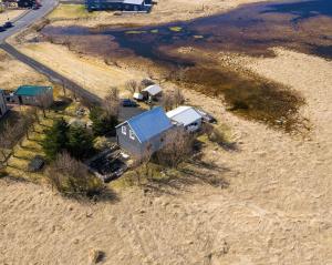 an aerial view of a house on the beach at Tjarnarkot in Sandgerði