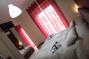 A bed or beds in a room at Il Centro Short Lets