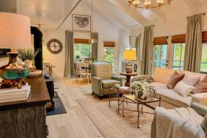 a living room with a couch and a chair at Dragonfly Cabin in Scaly Mountain