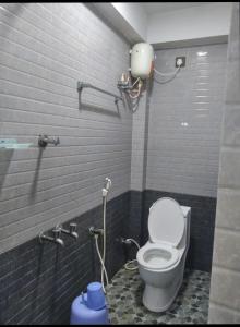 a bathroom with a toilet in a stall at SNN Residency in Rāmeswaram
